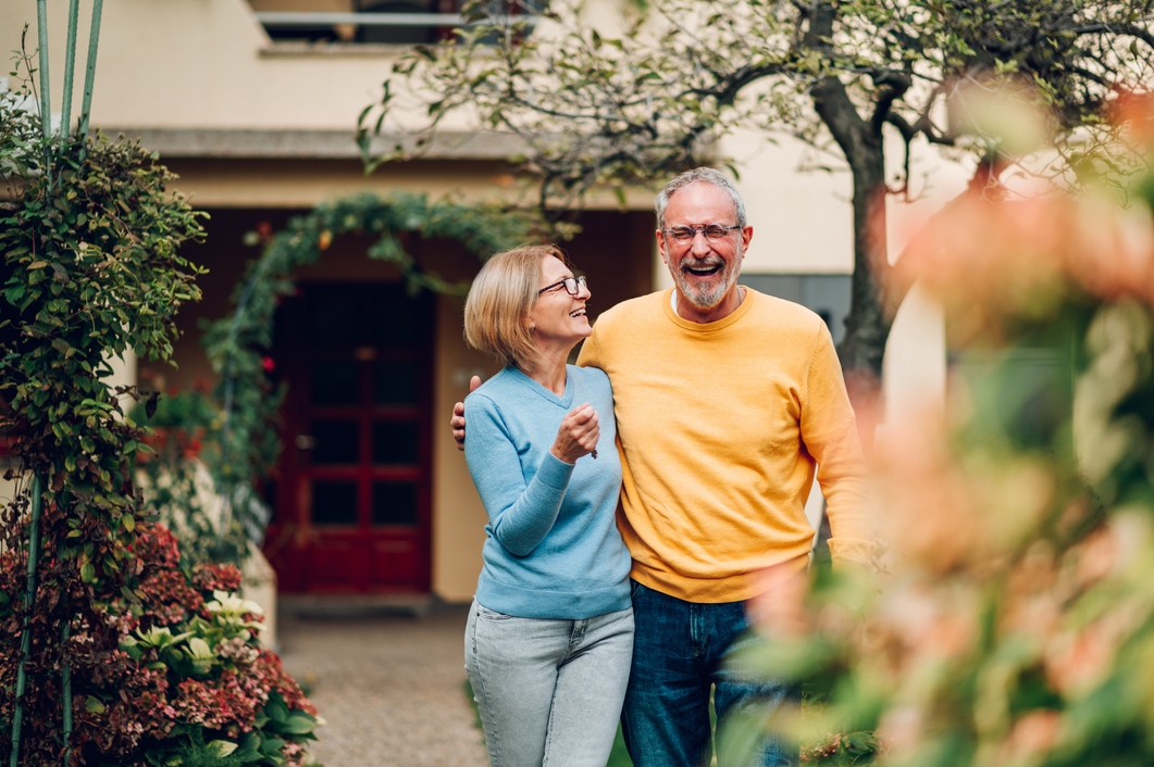 Couple in front of house