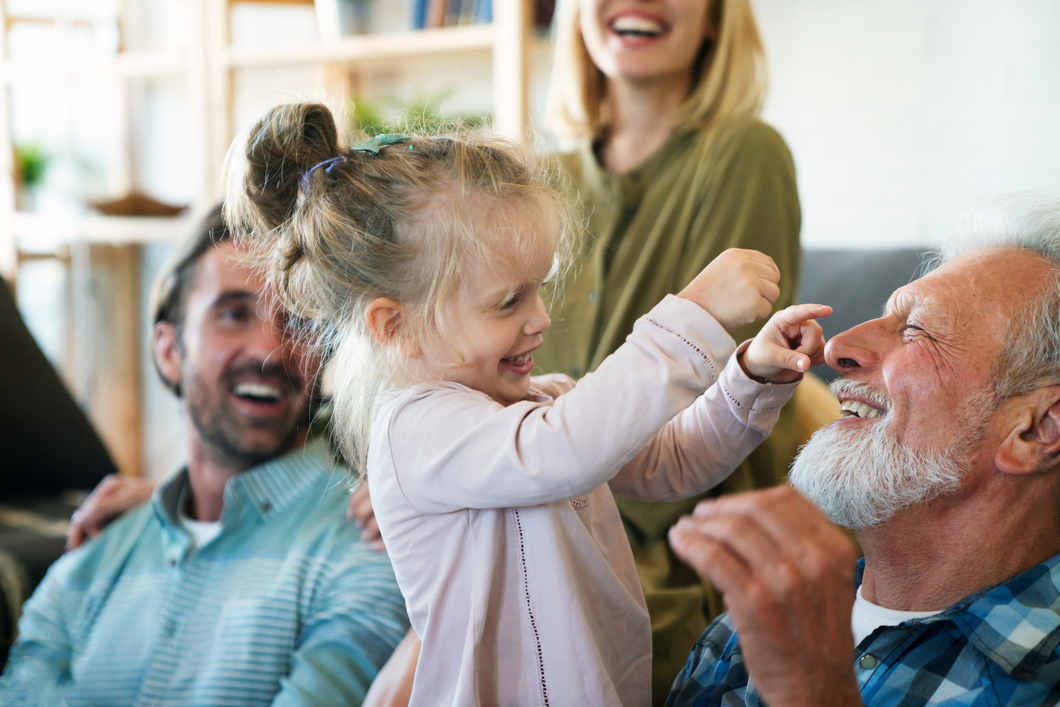 Grandfather playing with child