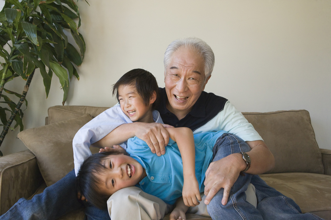 Grandfather playing with grandchildren