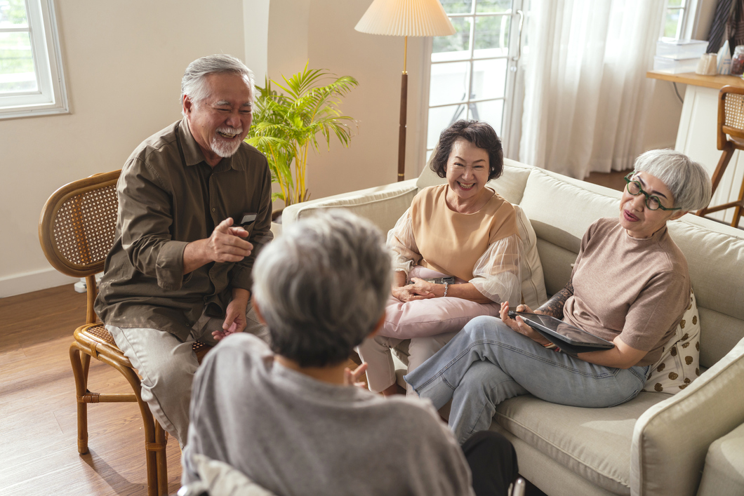 Senior asian friends laughing together