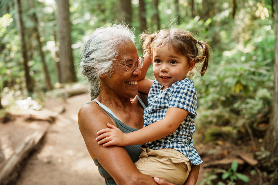 Senior woman hiking with granddaughter